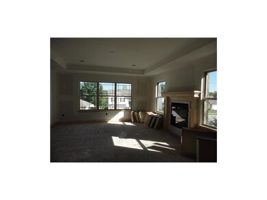 LIVING ROOM IS OPEN TO THE KITCHEN AND DINING AREA