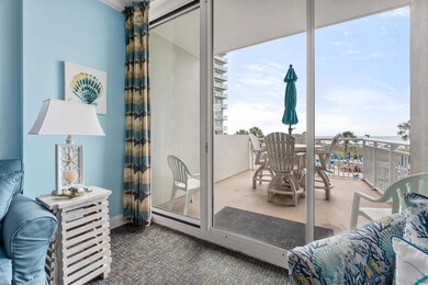 View of patio featuring a balcony