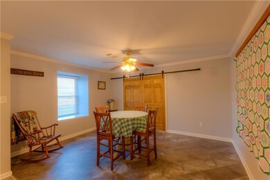 Stylish barn doors lead into the original dining r