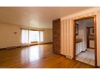 The dining room is open to the living room and flo