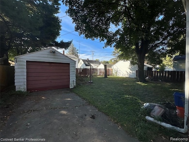 Detached garage featuring driveway