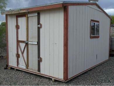 Storage shed in back corner