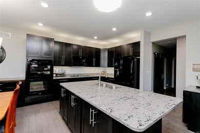 Kitchen with additional cabinetry and prep sink in
