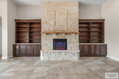 Living Room w/ Fireplace & Built-ins