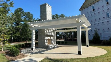 Outdoor fireplace and arbor