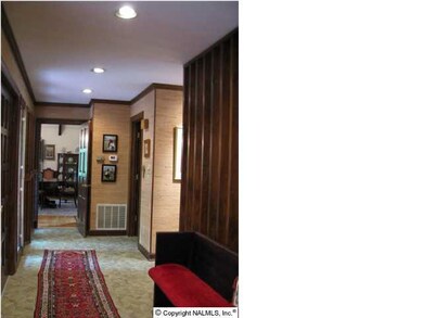 Front foyer with floor to ceiling windows and double storage closets and tile floors!
