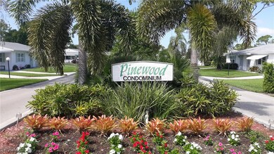 Community / neighborhood sign with a yard