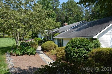 Side view & garden path to the front door.