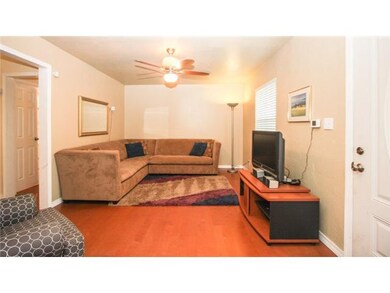 Living Room. This spacious living room fits this very large pit group and more!  Opens up to the dining area. Laminate floors have a real wood veneer.