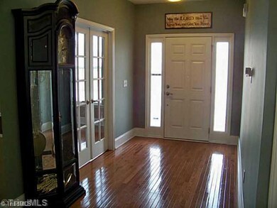 Entry. Gorgeous foyer has glass doors that enter into study. Lots of natural light from sidelights.