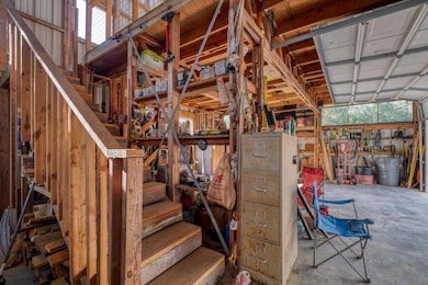 Detached garage interior with workshop space and storage