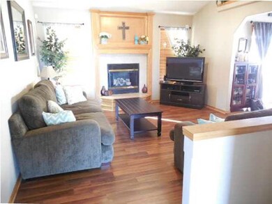 Laminate flooring in well lighted living room with