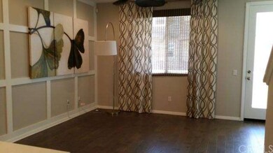 Large living room with designer accent wall, windo