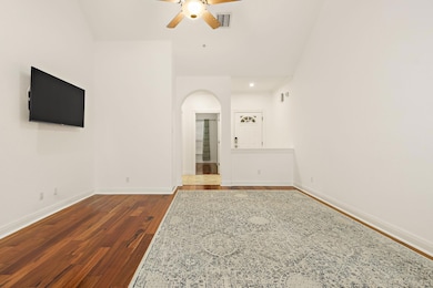 Unfurnished living room with a ceiling fan, baseb