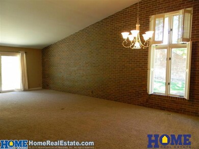 As you enter the front room you notice the tall ceilings and abundant light. There is all new carpet on both main and lower levels.