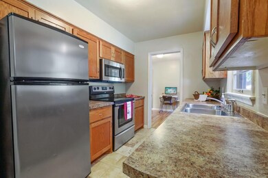 Updated kitchen with stainless appliances .