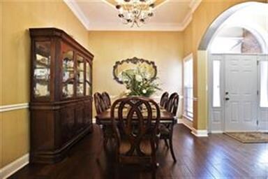 THE DINING AREA IS SPACIOUS  AND FEATURES CHAIR RA