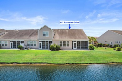Back of house featuring a water view, central AC, 