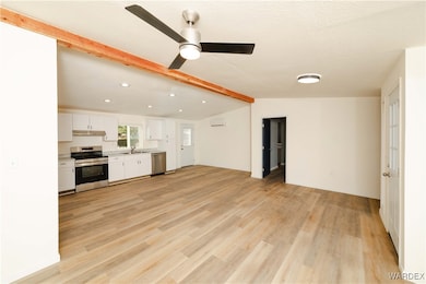 Unfurnished living room featuring recessed lightin