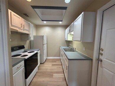 Kitchen with electric range, under cabinet range 