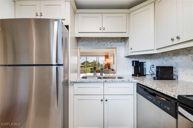 Kitchen with appliances with stainless steel finis