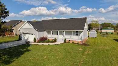 View of front of property with a porch, concrete d