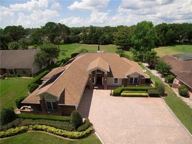 Over sized lot with an over sized brick paver driv