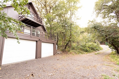 Garage featuring driveway