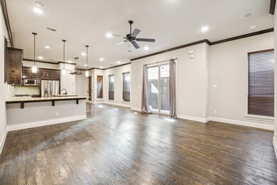 Unfurnished living room featuring crown molding, dark wood-type flooring, recessed lighting, and a ceiling fan
