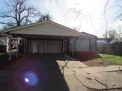 Garage with a garage and fence