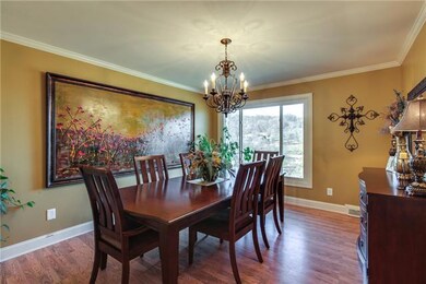 Hardwood floors through out this dinning room. Invite all of your family and friends over for dinner while you enjoy the gorgeous view! 