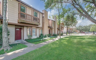 This is a two-story townhouse with a brick and woo