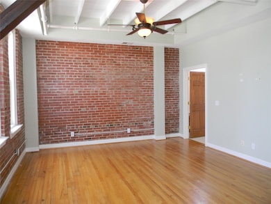 Open Design With Brick And Hardwood