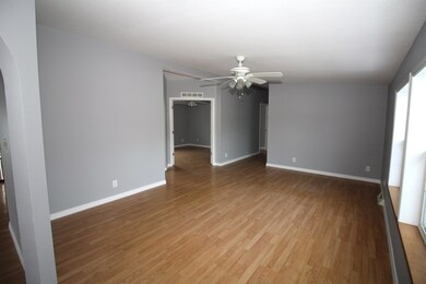 LIVING ROOM LOOKING AT OFFICE & HALLWAY