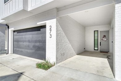 Garage featuring driveway