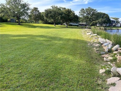 View of grassy yard with a water view