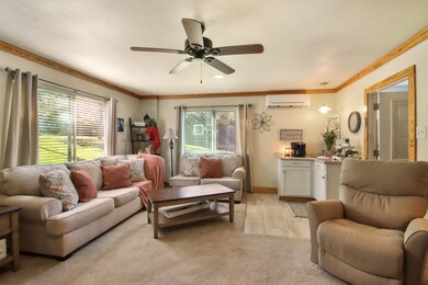 Living room has windows for plentiful natural ligh