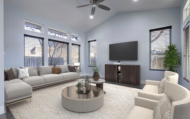 Living room featuring baseboards, a ceiling fan, 