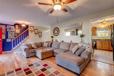 Front entry with open living room, powder room, an