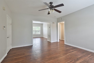 Neutral paint colors and easy to care for laminate floors throughout the apartment including this spacious living room.