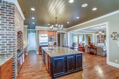 Spacious kitchen featuring knotty alder cabinets w