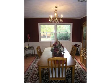 Lovely Formal Dining Room with laminate floors.
