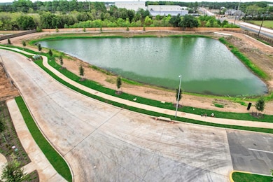 community walking path with water view
