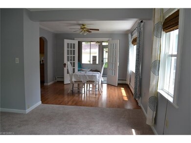 Living room opens into the large dining room with 