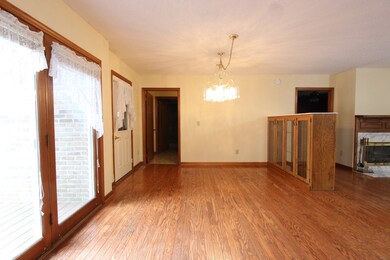 Dining Room as seen from the kitchen. French Doors lead to the back deck and single door goes to the oversized 2 car garage