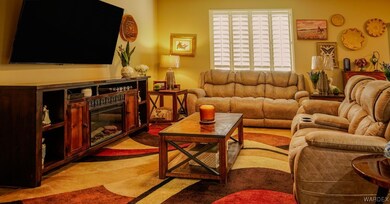 Open living room featuring light colored carpet