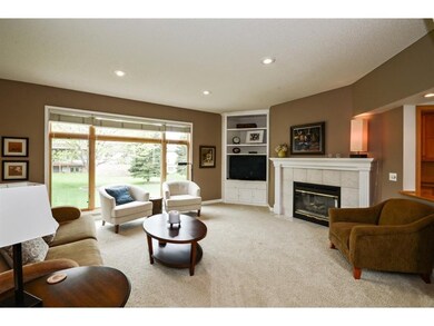 Spacious living room with large window and nice fi