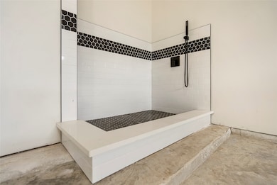 Designated Pet shower in oversized garage.