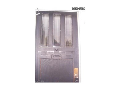 Original door from 1900. New storm door on outside
