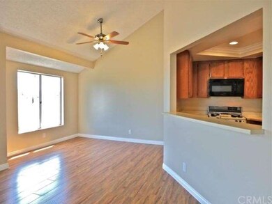 The dining nook features a big, bright window with